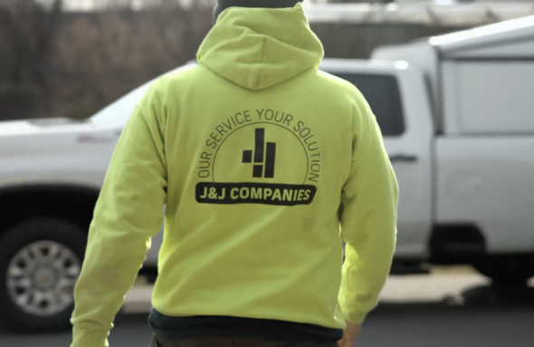 J&J Companies team member walking to a company video